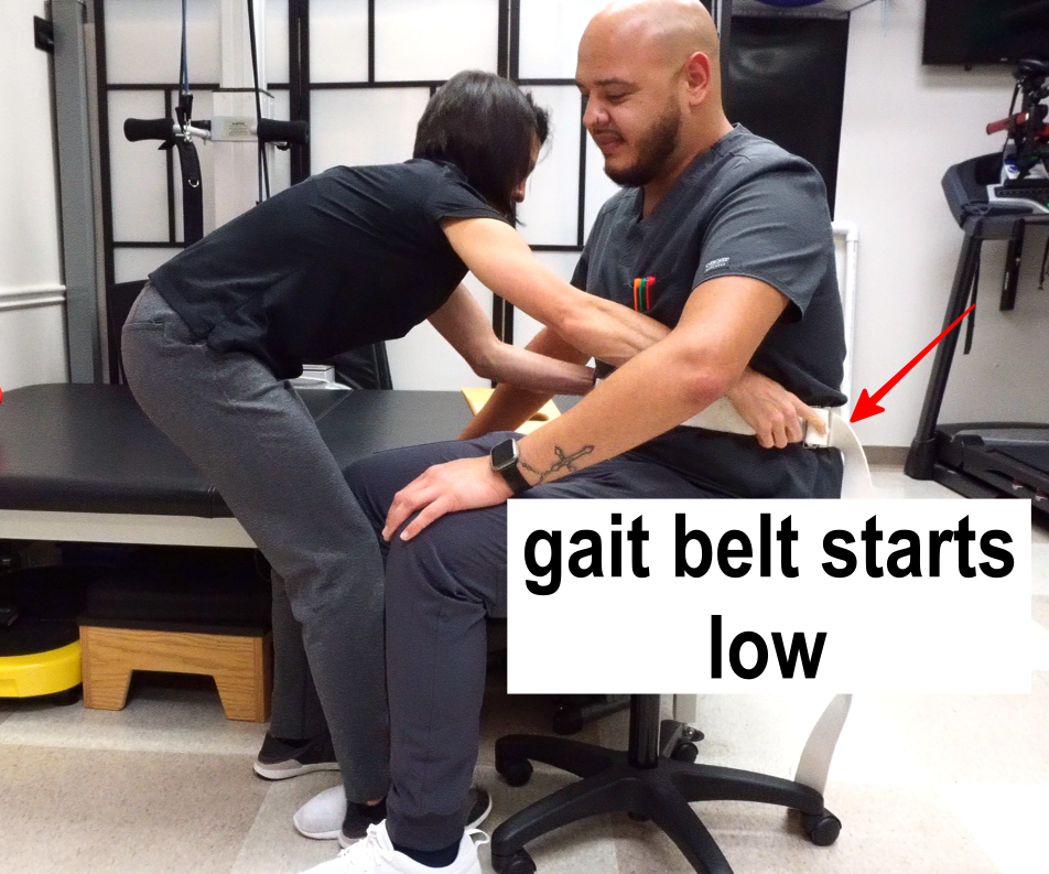 female transfering male with standard gait belt step 2