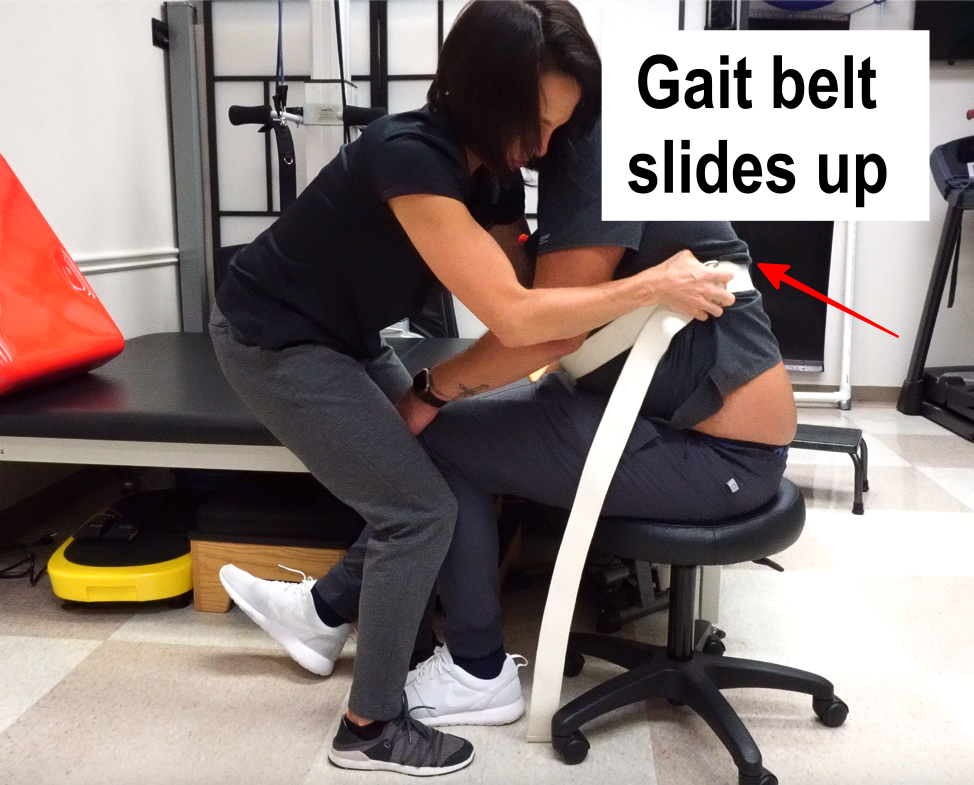 female transfering male with standard gait belt step 1