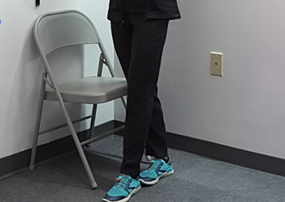 Image of Tara Tobias with her left foot placed in front of her right foot.